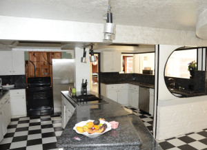 The remodeled kitchen reminiscent of a  ship galley.