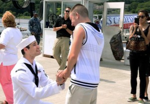 Petty Officer 2nd Class Jerrel Revel, left, proposes to his boyfriend Dylan Kirchner during the homecoming of the USS New Mexico at the submarine base in Groton, Conn., after the ship's inaugural six-month deployment. Photo: U.S. Navy/Kristina Young