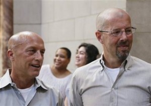 Same-sex couples Todd Vesely, left, and Joel Busch, right, and Lisa Blakey, second left, and Janet Rodriguez, second right, are two of three same-sex couples who are challenging a Nebraska policy that prevents them from serving as foster parents. Photo: NATI HARNIK / AP PHOTO