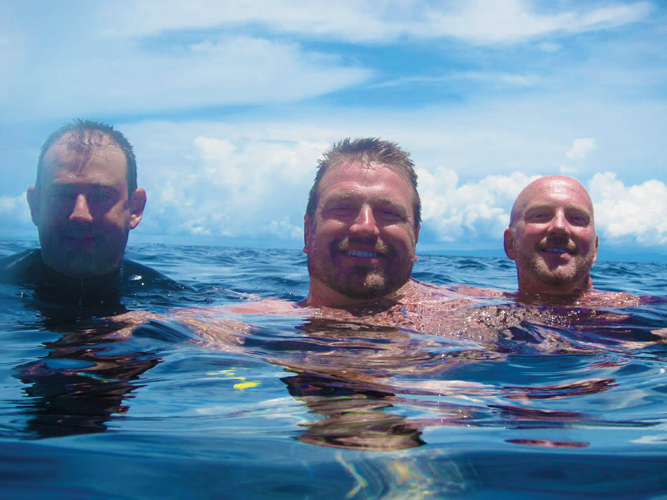 Undersea divers (l–r) Scott Pitkethy, Greg Hamman, and Ron Maynard in Fiji. Photo by Josh Deerman. 