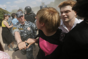 Riot police detain gay rights activists during their rally in St. Petersburg, Russia, on June 29, which proceeded with official approval despite recently passed legislation targeting gays. The law has led to calls for a boycott of the 2014 Olympic Games in Sochi.  Photo: Dmitry Lovetsky/Associated Press
