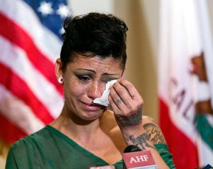 Cameron Bay, an adult film performer who became infected with HIV while working in the industry in August 2013, cries as she speaks out about her treatment by the porn industry during a news conference sponsored by the AIDS Healthcare Foundation. Photo: DAMIAN DOVARGANES/AP