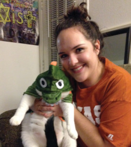 Anna Godwin proudly shows off her six-year-old cat, Murphy, dressed in his dinosaur Halloween costume. Murphy is a super-laid-back rescue cat that loves parties, likes spooning, and lets Godwin dress him up on a regular basis.