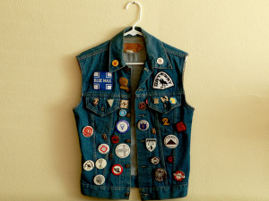 A denim motorcycle club vest adorned with pins from other clubs that is part of Steven Brawley's LGBT collection in Kirkwood, Mo. Photo: AP Photo/St. Louis Post-Dispatch, Huy Mach